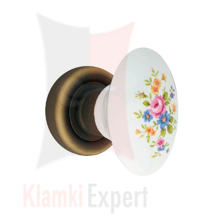 Klamka Flavia 680, porcelana biała z różowym kwiatem na rozecie okrągłej 103 BM brązowiony matowy, ciemny