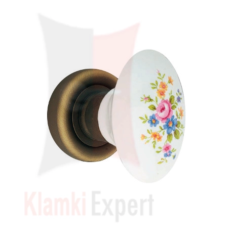 Klamka Flavia 680, porcelana biała z różowym kwiatem na rozecie okrągłej 103 BM brązowiony matowy, ciemny